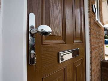 Close up of door handle and letterbox.