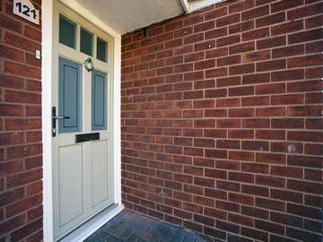 Timber alternative entrance door from the English Door Company range. Door was supplied in a bespoke colour with feature glazing and chrome furniture.