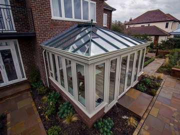 Roof detail in green on garden room maxmising on light.