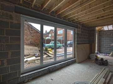 Internal view of aluminium Centor bifold doors installation in Formby, Liverpool.