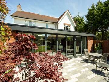 Large grey aluminium bifold doors with matching aluminium fascia boards supplied and fitted on the Wirral to complete this stuning open plan living space.