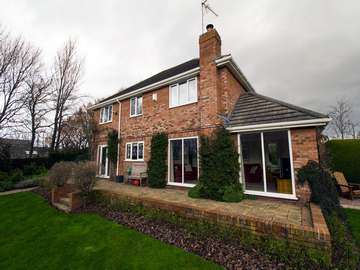 Rear shot of house after complete replacement of all windows and doors in using modern UPVC frames.