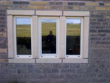 Moseley in the peak district. Our design team was asked to provide a window that would conform to passivhaus standards but retain the look of an old peak district cottage. Our Internorm home soft aluminium timber windows were selected offering a window U value .9 glass .6. the new Internorm home soft Ali timber comes triple glazed 44mm sealed unit. The Internorm home soft frames were polyester powder coated to the clients bespoke Real colour. The installation was carried out in 2 days by our Cheshire window and door installation team