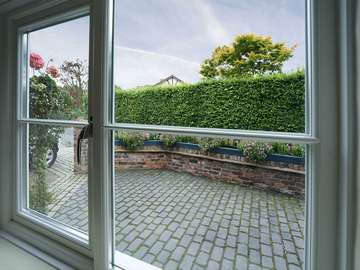 Close up internal shot of timber window with double glazing in Cheshire.