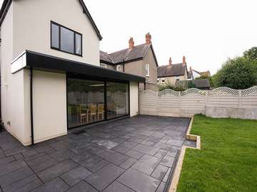 External view of large Dutemann black sliding door installed in Colwyn Bay, North Wales. 