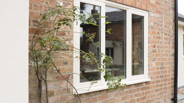 Close up of one of the timber windows with a painted finish.