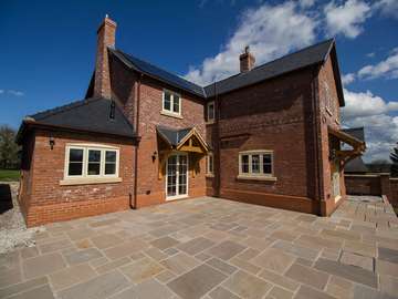 New build with complete glazing installation of Residence 9 windows in Cotswold biscuit. All windows and doors are fitted with triple glazing for enhanced energy efficiency.