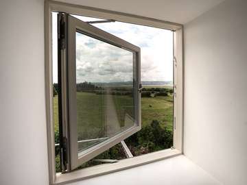 Rationel alu-clad triple glazing timber window making the most of the stunning views. 