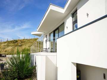 Abstract view of Rest On The Hill development. Full glazing installation completed by us including  a range of grey (RAL 7016) alu-clad timber windows and doors.