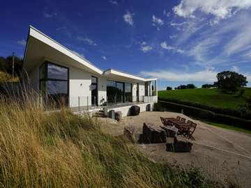 Full main house picture showing stunning Internorm installation to complete this eco home build. 