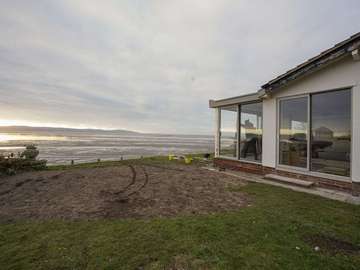 Seaview from the property featuring 3 sets of Dutemann aluminium sliding doors.