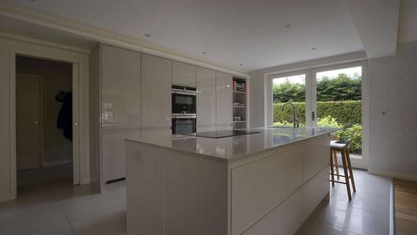 Internal view of the customer kitchen opened up with a set of Rationel french doors.