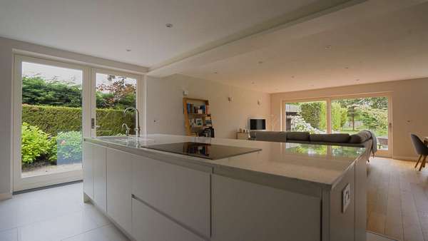 Another view of this stunning contemporary living space featuring one Rationel sliding door and a set of Rationel french doors.