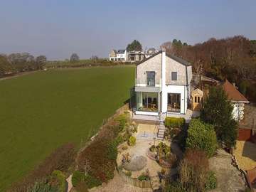 Straight on view of this full house installation with raised glass balcony area the perfect place to make the most of the countyside views and evening sunsets. All glazing is triple glazed throughout to maximise on energy efficiency.