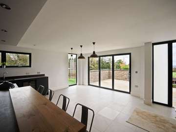 Open plan living space making the most of the view and living areas with bifold doors.
