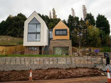 New build property featuring double height aluminium windows in Kelsall, Cheshire.