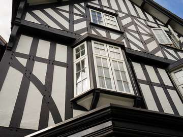 Close up of smaller bay window at the front of the property featuring white casements with georgian bars to sit perfectly in this Edwardian home in Chester.