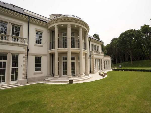 Close up of the rounded bay with matching stone columns.