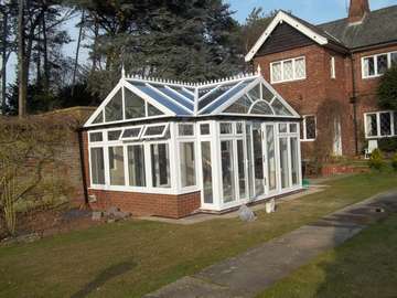 Mr & Mrs R. Willaston . South Wirral _ Design and biuld ; White PvcU Conservatory glazed with Celsius one units to the roof. Planitherm plus to all windows. The biuld included underfloor heating, tiling and all biulding work. 