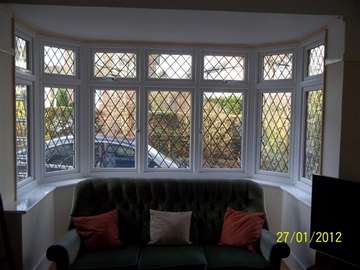 Mr& Mrs H. Greasby, Wirral : Internal view of a 2800 white PvcU installation. showing dummy vent finish to give same sight lines. Antique lead to match the existing window design. 