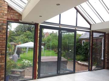 Mr & Mrs E, West Kirby, Wirral : Internal view of Centor C1 double glazed Bi-fold doors with marine finish. With a combination Allstyle gable ended double glazed point. Aluminium spared ATS roof system with double glazed celsius glass. Example of aluminium triple glazed bi-fold doors. Aluminium bi-fold doors near Macclesfield SK11. Alumnus doors with 44mm triple glazing near Alderly Edge SK9. Aluminium Bi-fold doors near Wirral CH48 CH60. Alumnus Bi-fold doors triple glazed Liverpool Formby L37 near South Port PR8 Bi-fold doors near Crosby L23