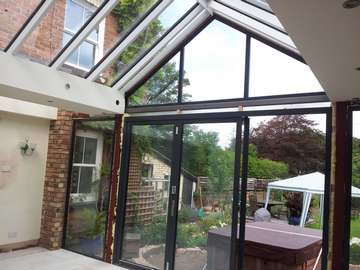 Mr & Mrs E, West Kirby, Wirral : Internal view of Centor C1 double glazed Bi-fold doors with marine finish. With a combination Allstyle gable ended double glazed point. Aluminium spared ATS roof system with double glazed celsius glass.