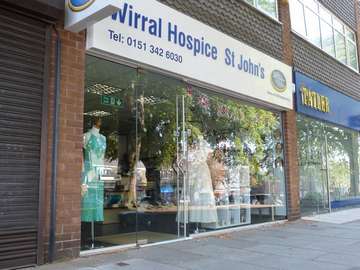 Heswall Village : Shopfront replacement. CRL All glass shopfront system, glazed with 12m Heat-soaked toughened glass. 