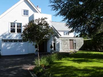 Irvine Consulting Architecture : New Build project : Installing White wood PvcU Vertical sliding sash windows double glazed . Hardwood Front Door to Architects design 