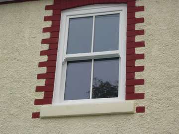 Mr & Mrs E. Chester : Installation of white wood PvcU vertical sliding windows . Cheshire sash windows have become very popular due to the look to timber sash windows Cheshire 