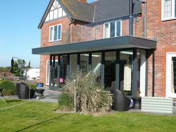 Caldy wirral : design and build: CLR Balustrade system 15mm heat-soak Toughened glazing . - 44m argon filled triple glazed bi fold doors - Manchester - Aluminium Bi fold doors Didsbury M20 - Aluminium Bi fold doors Prestbury SK10 - Aluminium Halebarns WA15 - Aluminium Bi fold doors Nantwich CW3 - Aluminium Bi fold doors Macclesfield SK11 - Aluminium Bi fold doors North west - Centor C1 Bi fold doors North west - Centor C1 Bi fold doors Cheshire - Centor C1 Bi fold doors Liverpool Centor C1 Bi fold doors Formby L37 - Centor C1 Bi fold doors Crosby L23 Our Aluminium Bi fold range is polyester powder coated. They can come with either 28 mm argon filed double glazing or 44mm argon filed triple glazing. Our range of Aluminium Bi-fold doors are Centor C1, Schuco, allstyle, Upvc, and wood Bifolds. Our Aluminium Bifolds can be found on the Wirral in areas such a Caldy CH48, Aluminium Bifold doors can also be found in West Kirby CH48. Due to an explosion in property in Liverpool there a