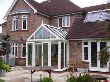 Professor H. Formby Lancashire : Alteration : Installation of an Ultraframe White PvcU Capped Roof Triple glazed with Pilkington Activ K U value 1. Windows and doors 2500 Deceuninck White PvcU triple glazed with 36mm units U value .85. to form walk in Conservatory 