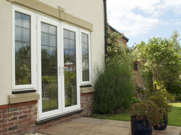 Mr H. - Formby: Installation of triple glazed PvcU French doors. Secure by design locking system. Black ash external window sills.