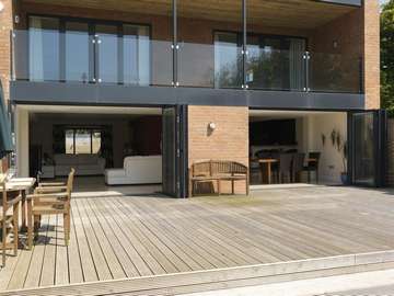 Eccles Manchester : Self Build Installation of Alstyle Polyester Powder Coated slimline Bi Folding doors. Double Glazed with Planitherm Plus Sealed units with Integral Blinds. also showing 15mm heat-soaked Balastrading 