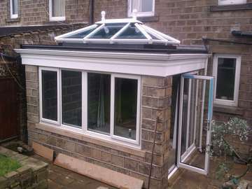 Doctor B. Hightown Cheshire: Design and build orangery with Slimline Bi folding doors, Celsius one roof glass constructed on a premier bespoke ornagery roof system 