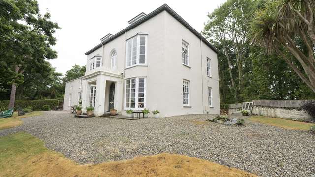 A view of the full home including the original sash windows on the main part of the building, they match the newer windows on the extension perfectly.