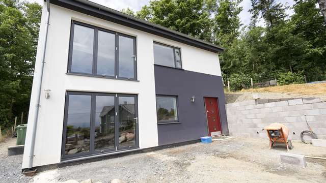 Close up of the front elevation of this home fitted with Rationel windows and dual Centor bifold doors.