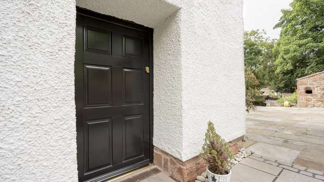 An image of the same door without the added door furniture at the side of the property.