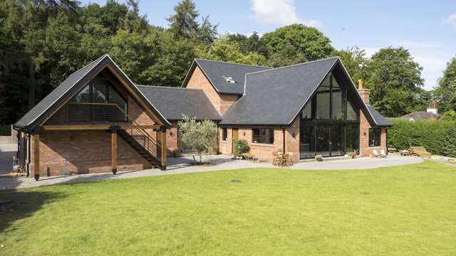 Looking down at the property from an elevated position, the large glass pitched window with dual sliding doors gives fantastic views and access to the garden.