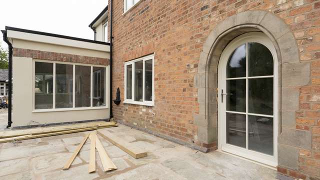 Close up of the timber arched door with feature glazign bars.