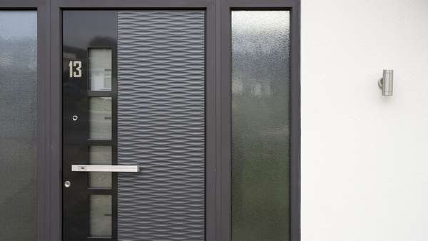 Close up of the Spitfire aluminium door with stainless steel handle complete with integrated fingerprint technology.
