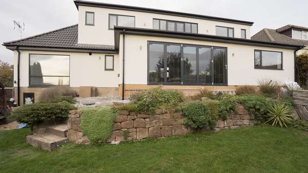 Image of the rear of the house showing the Centor aluminium bifolding doors.