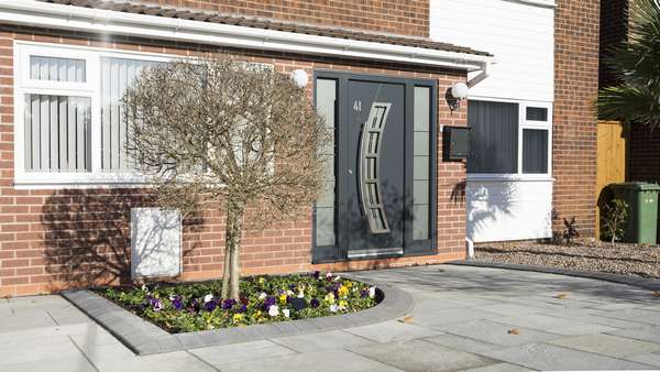 Aluminium entrance door from Spitfire supplied and installed in Wirral, featuring curved design and handle.