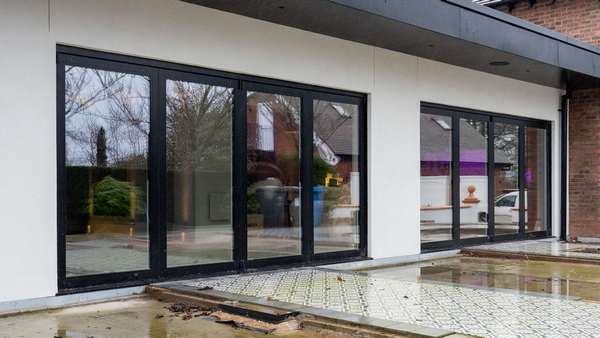 External view of the Centor aluminium bifold doors, finished in powder coated aluminium externally.