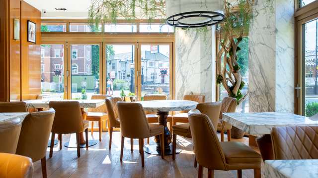 Inside one of the dining areas in CIBO featuring the Solarlux bifolding doors.