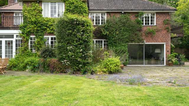 Wide shot showing the aluminium sliding door within the content of the home.