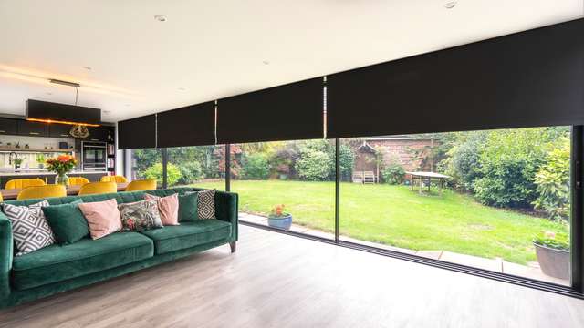 Flush ceiling integrarted electric blinds.