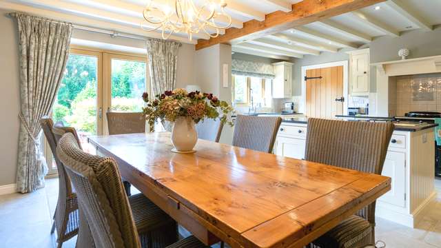 Internal view of the kitchen and dining area with Golden Oak flush UPVC windows.