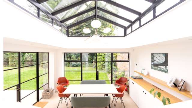 Straight on view of orangery extension with Crittall screens and large roof lantern.
