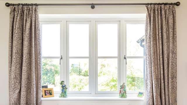 Internal close up of timber alternative flush UPVC windows.