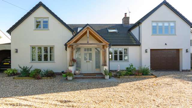 Front view of the property showing flush UPVC window installation.